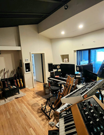 Close-up of a musician playing an instrument in the studio